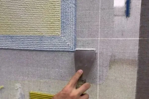 applying glue to rug